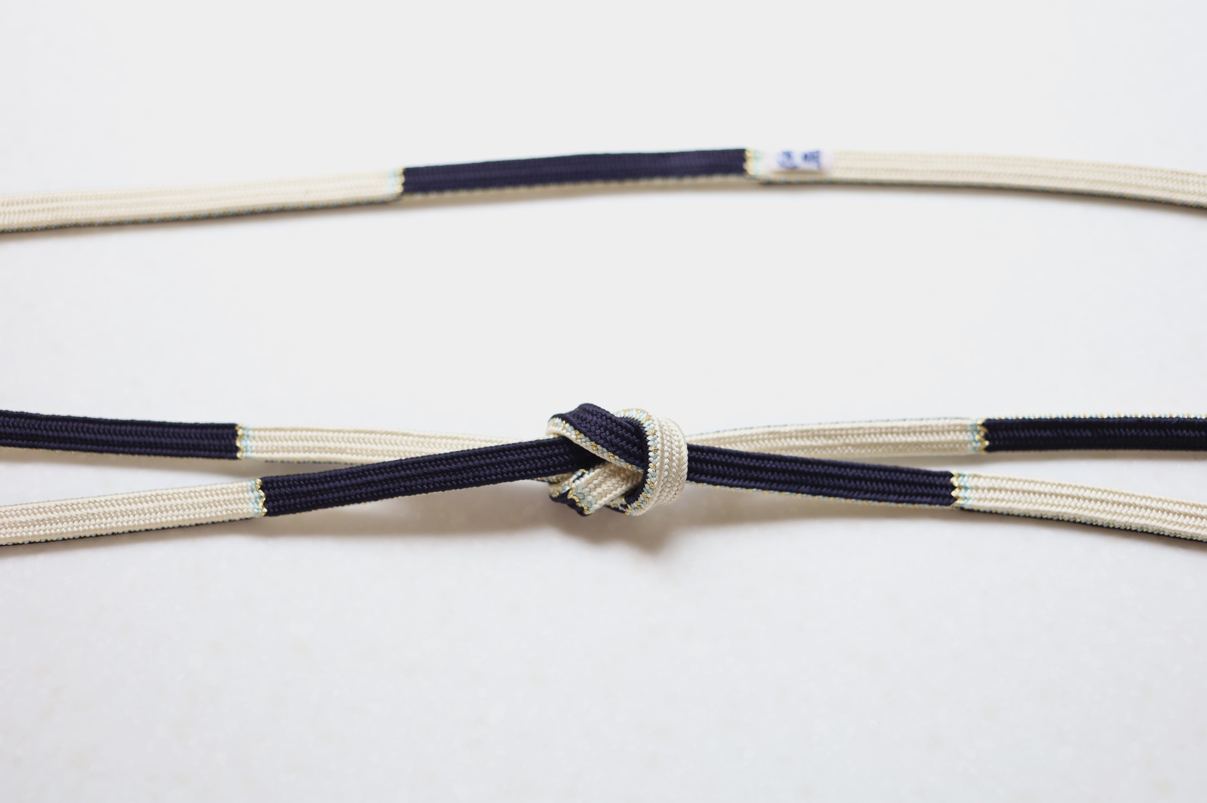 二段四枚組「志保」本科〈帯締め〉 – 有職組紐 道明