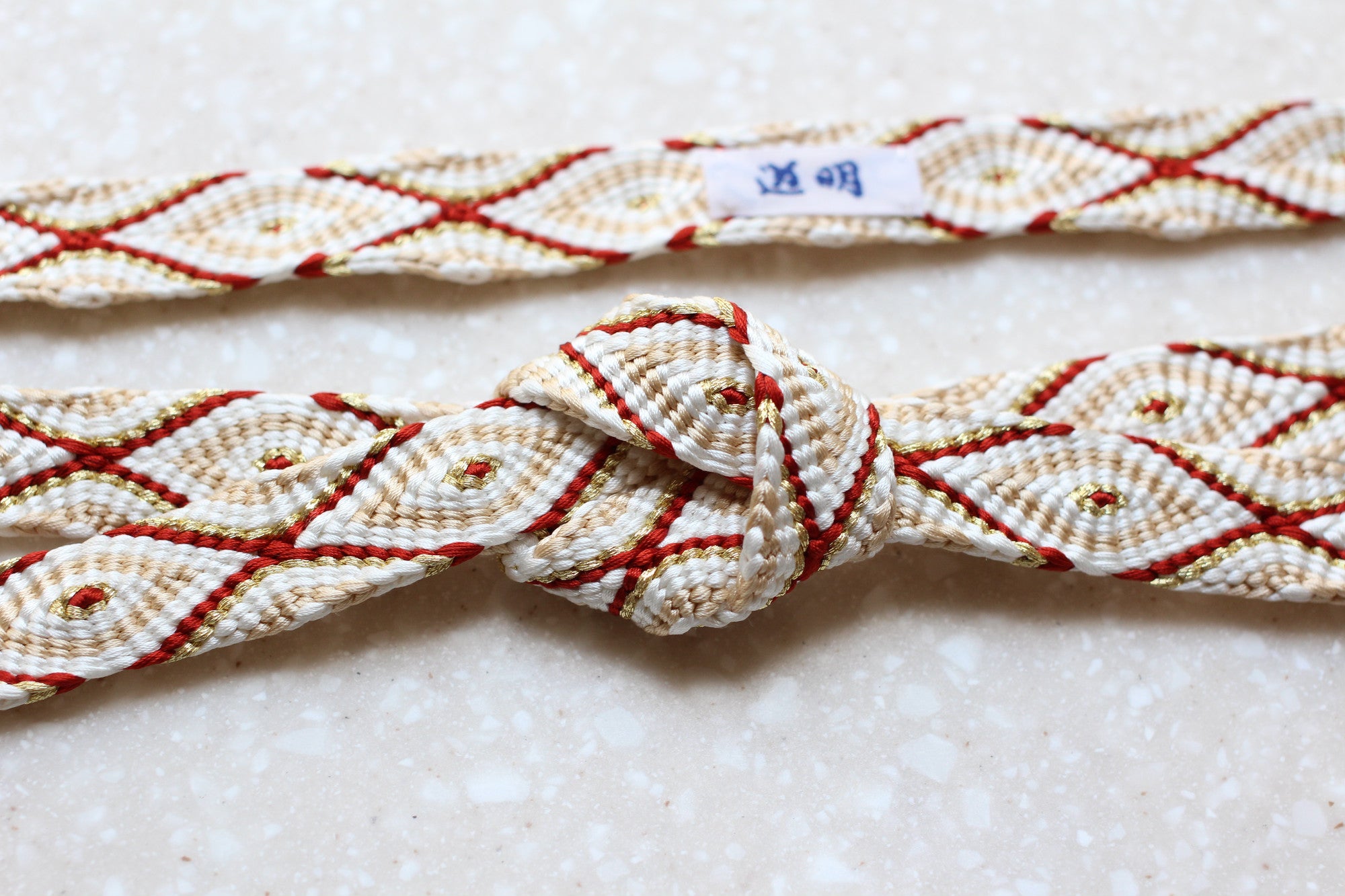 唐組「桐壺」錆朱〈帯締め〉 – 有職組紐 道明