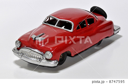 ブリキのおもちゃ クラッシックカーセダン赤3 昭和30年代の写真素材