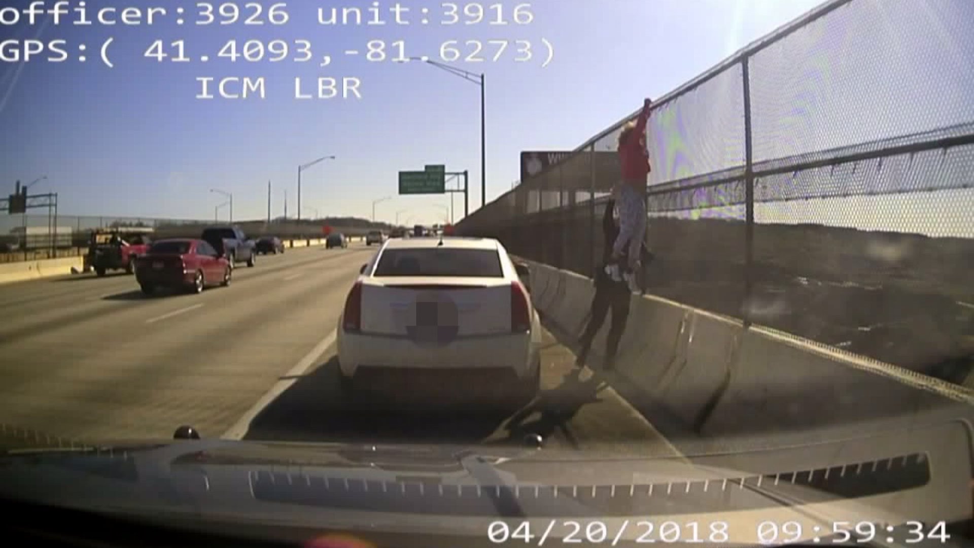 VIDEO: Officer stops woman from jumping off I-480 bridge | Fox 8