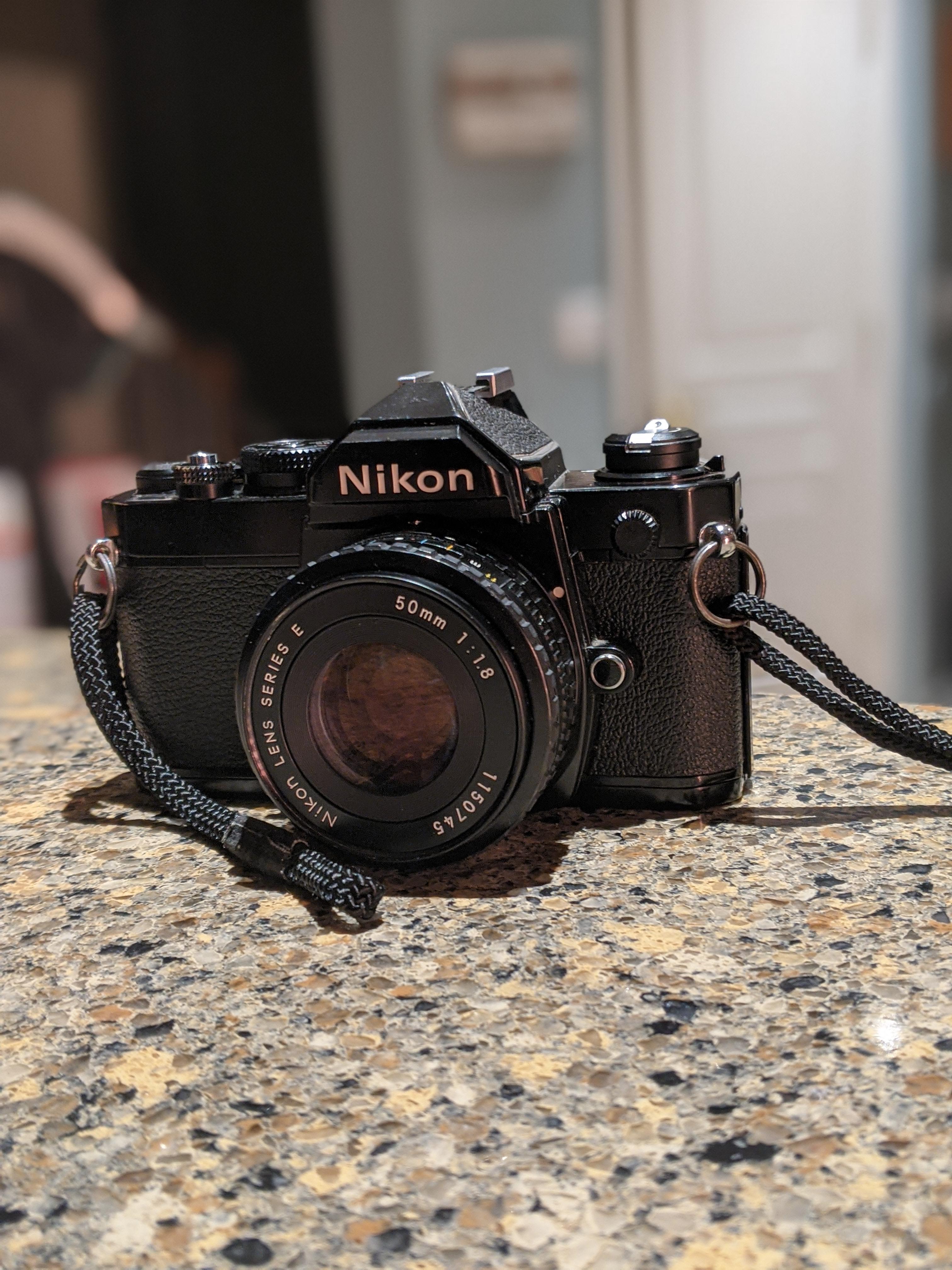 New toy! Nikon FM with the 50mm 1.8 Series E lens. Lens was broken
