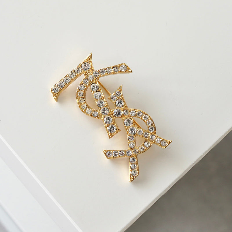 イヴサンローラン カサンドラロゴ YSLロゴ ラインストーン ブローチ GP