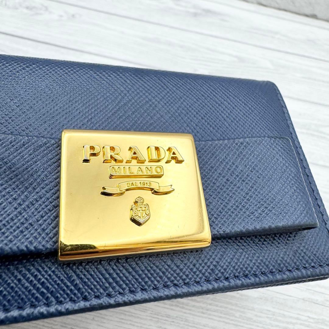 美品】PRADA サフィアーノレザー 名刺入れ リボン ネイビー - メルカリ
